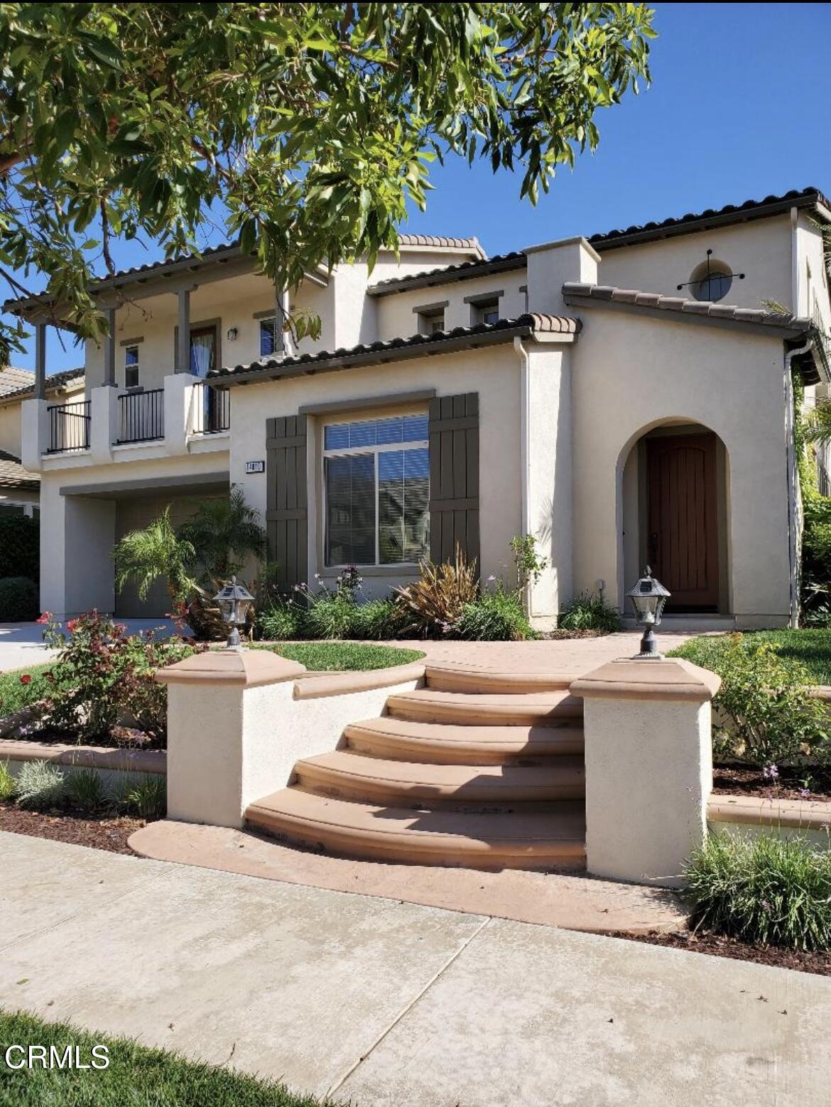 a view of a house with outdoor space and a car park