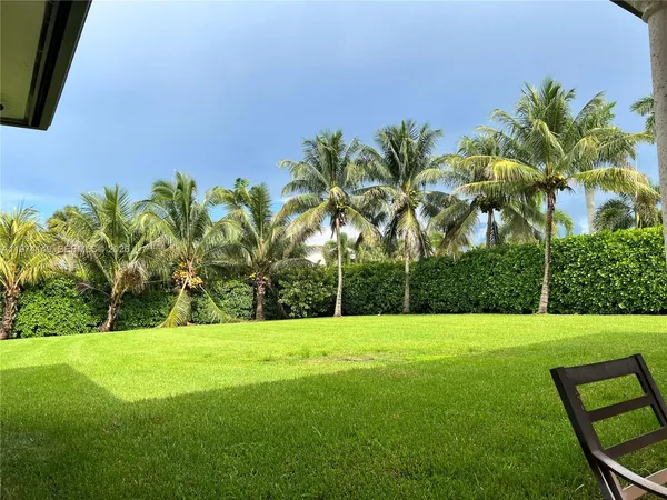 a view of swimming pool with a yard