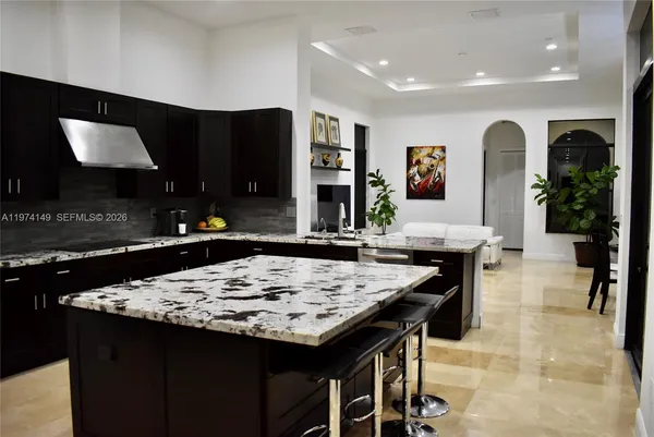 a kitchen with a table and chairs in it