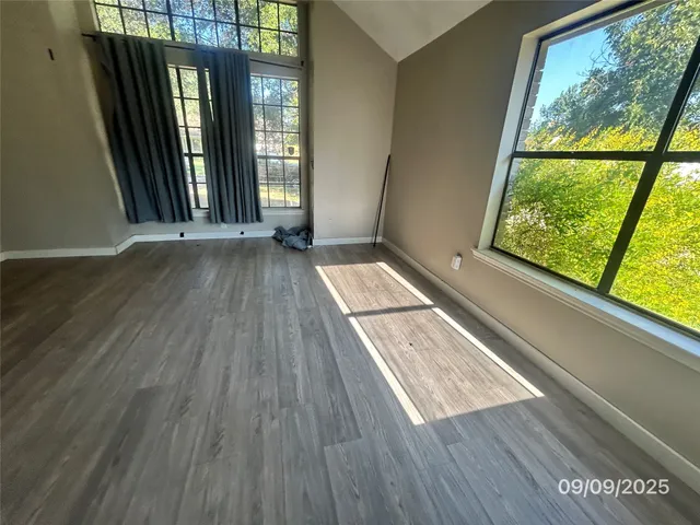 a view of outdoor space with wooden floor