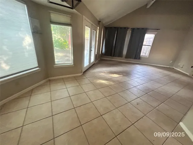 a view of an empty room and window