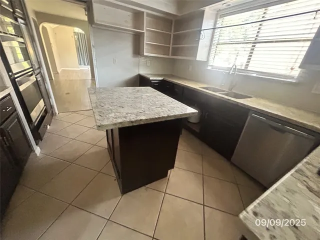 a view of a kitchen from a window