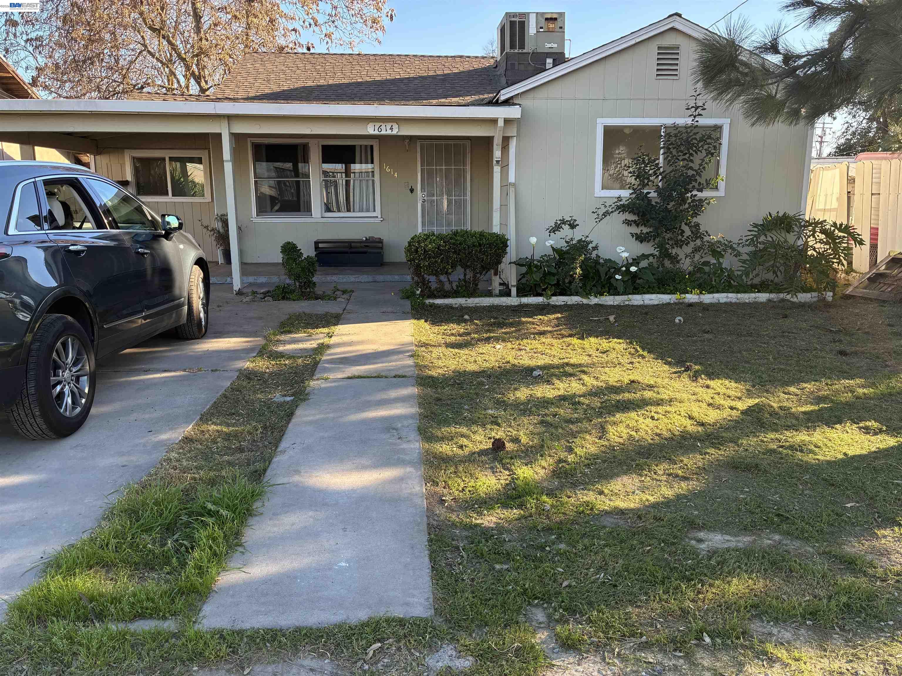 1614 Mono Drive Modesto, CA 95354 - Photo 1 of 15 a front view of a house with garden