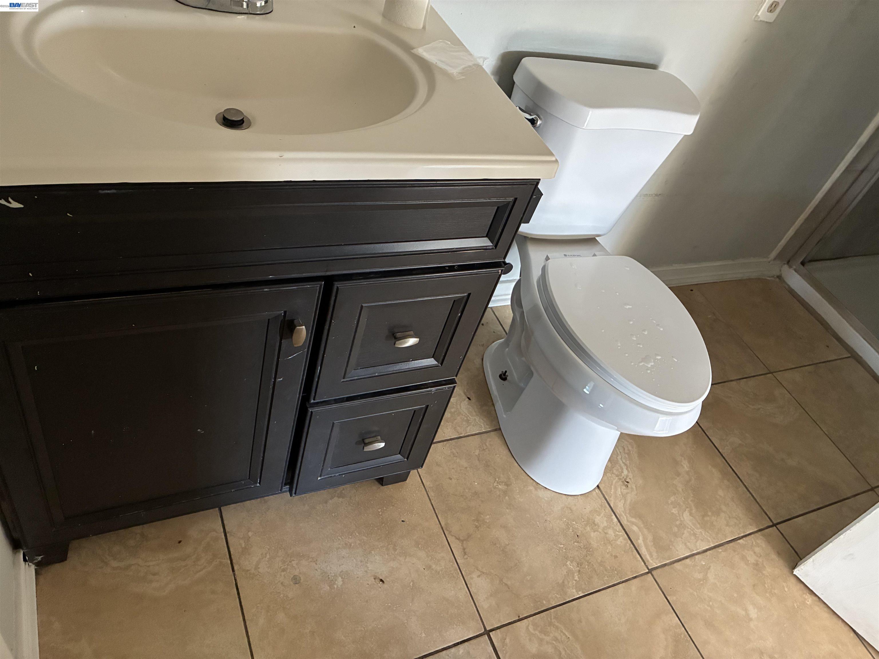 1614 Mono Drive Modesto, CA 95354 - Photo 11 of 15 a bathroom with a toilet and sink