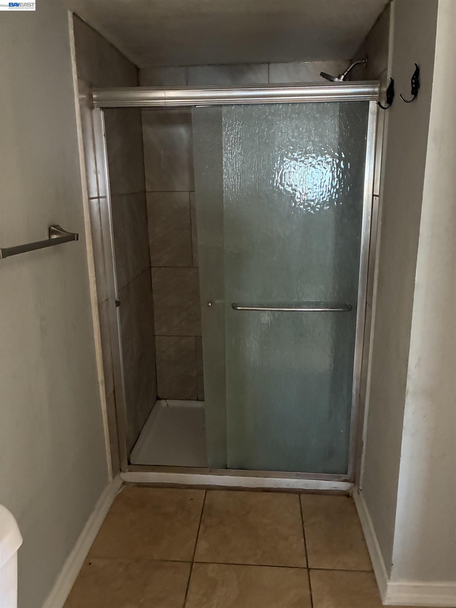 1614 Mono Drive Modesto, CA 95354 - Photo 12 of 15 a bathroom with a glass door shower