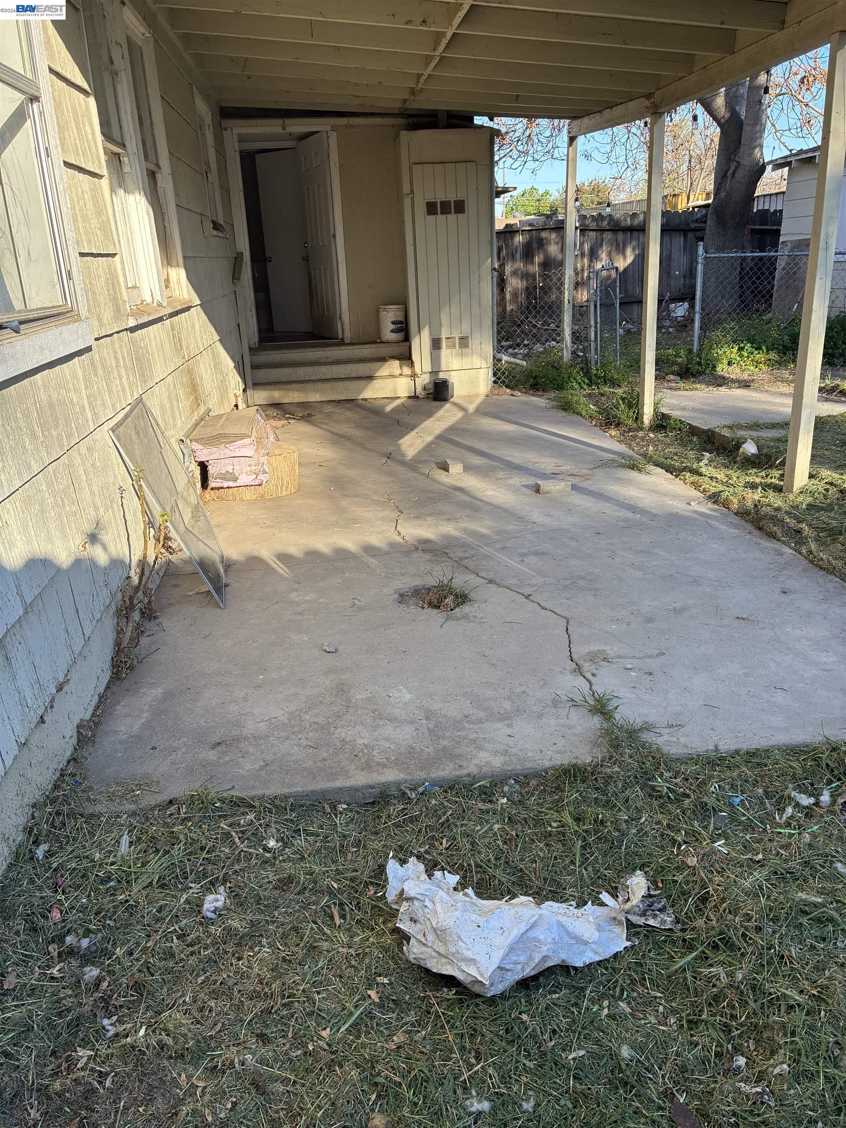 1614 Mono Drive Modesto, CA 95354 - Photo 14 of 15 a backyard of a house with yard and outdoor seating