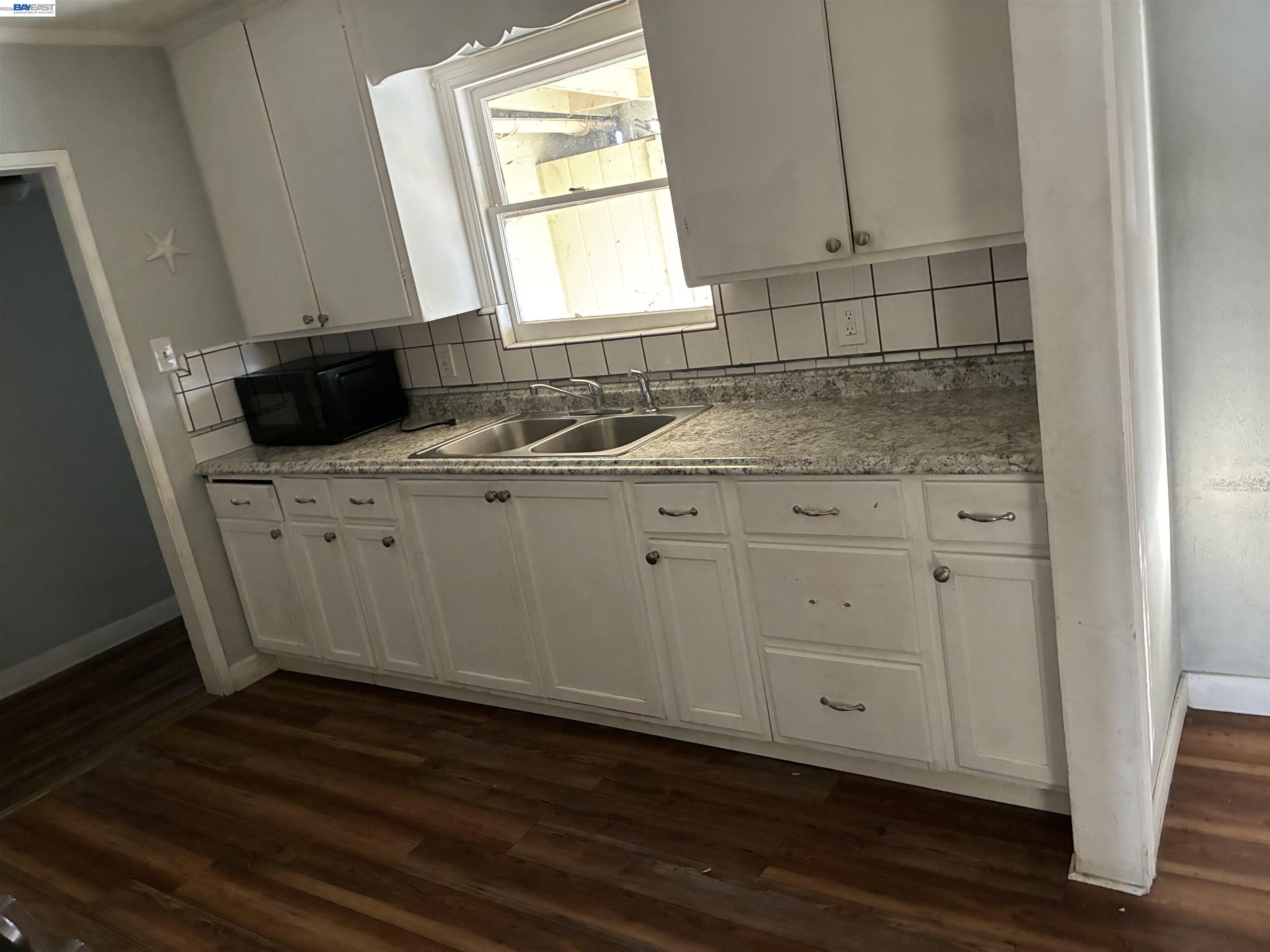 1614 Mono Drive Modesto, CA 95354 - Photo 3 of 15 a kitchen with a sink cabinets and a window