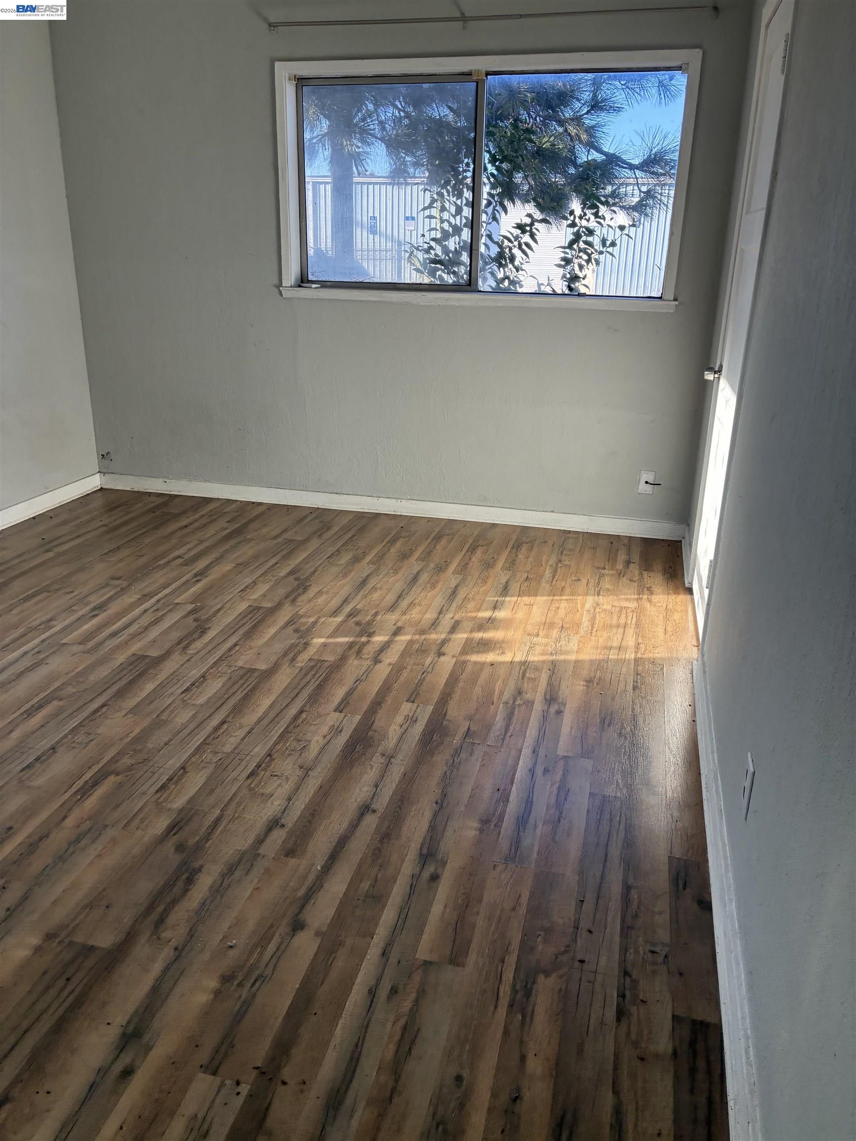 1614 Mono Drive Modesto, CA 95354 - Photo 7 of 15 a view of a room with wooden floor and doors