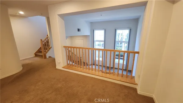 a view of a hallway with windows