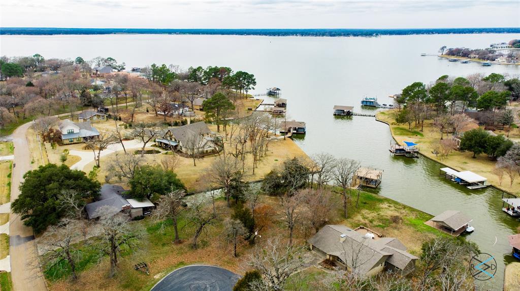 an aerial view of lake houses with outdoor seating