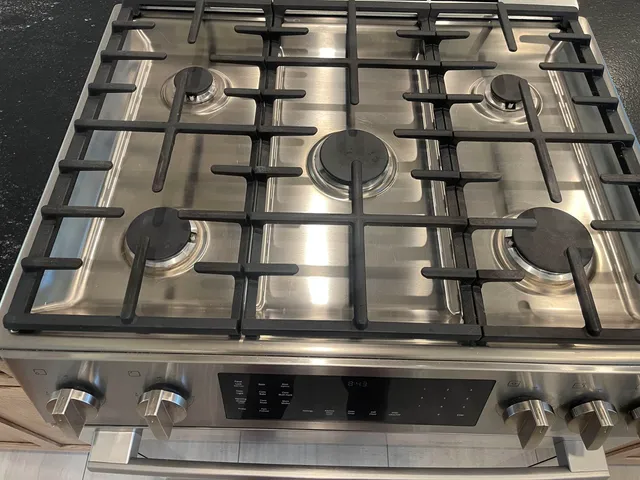 a view of a backyard with large trees