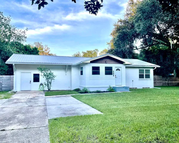 a kitchen with stainless steel appliances a stove a sink and a refrigerator