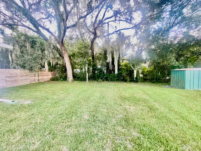 a view of a backyard of the house