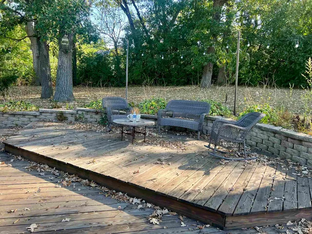 a view of a backyard with sitting area