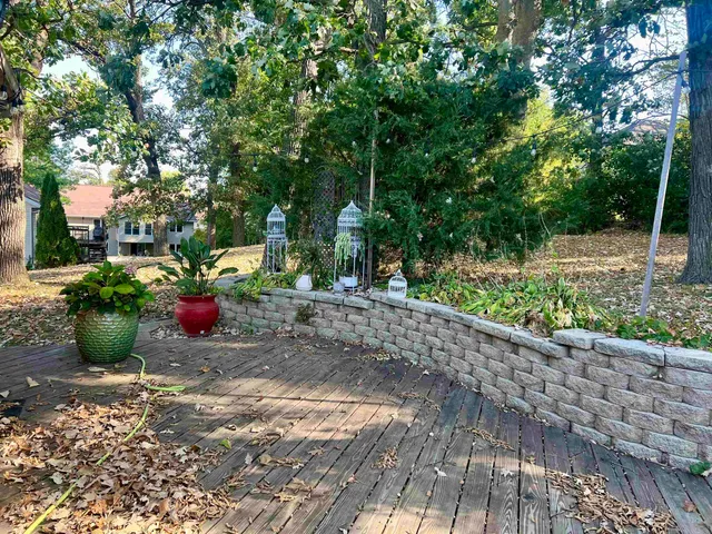 a view of a backyard with sitting area
