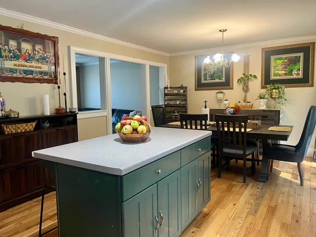 a kitchen with a sink cabinets and window