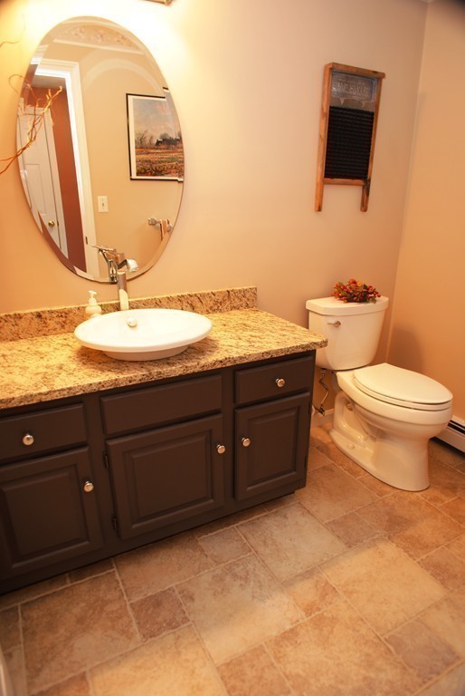 61 Blanchard Road Boxborough, MA 01719 - Photo 12 of 27 a bathroom with a granite countertop toilet sink and mirror