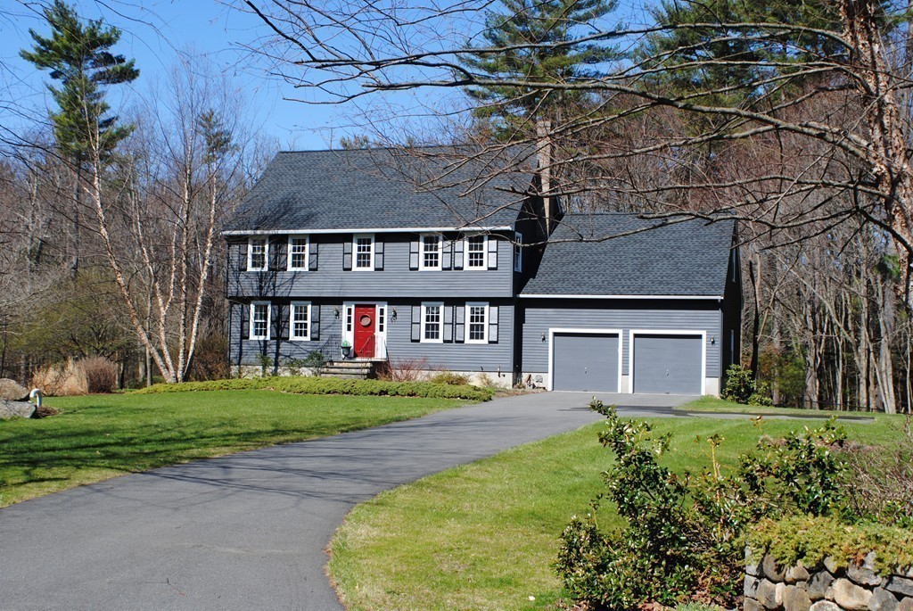 61 Blanchard Road Boxborough, MA 01719 - Photo 23 of 27 front view of a house with a yard