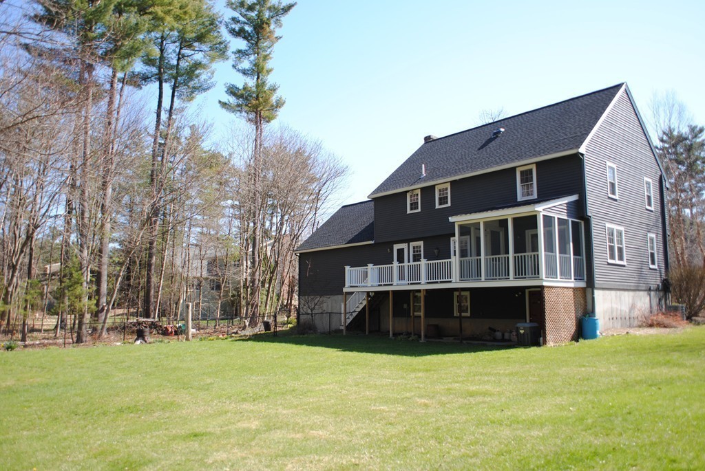 61 Blanchard Road Boxborough, MA 01719 - Photo 24 of 27 a view of a big house with a big yard