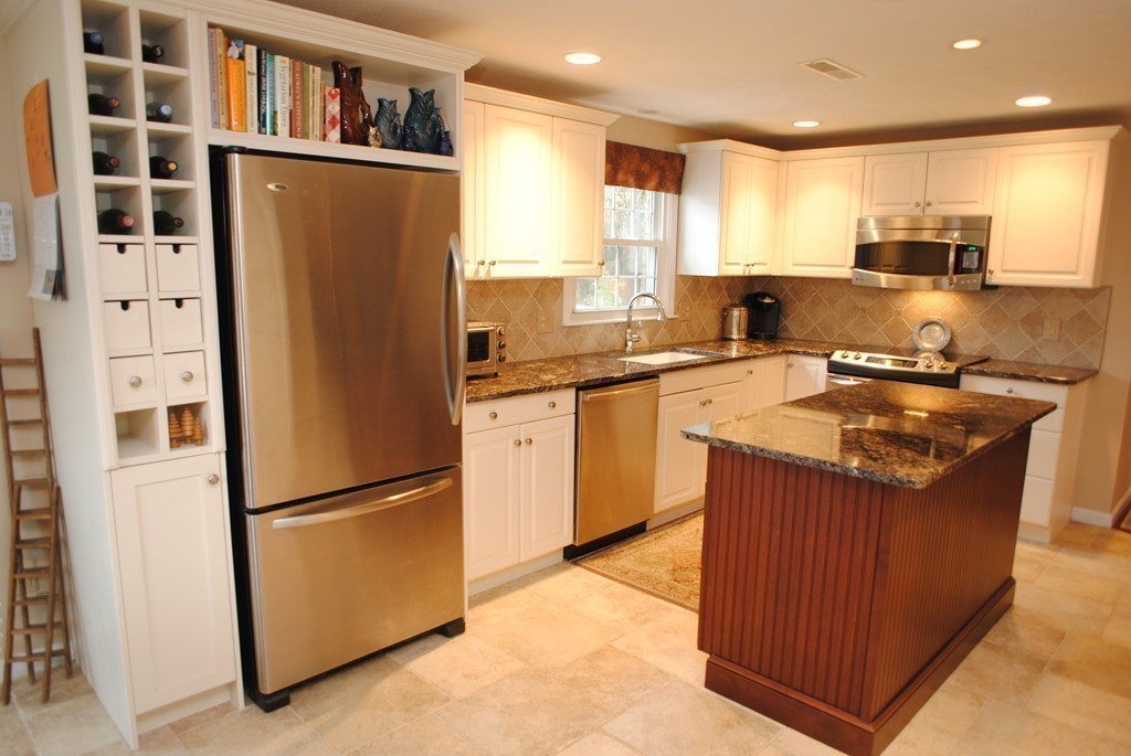 61 Blanchard Road Boxborough, MA 01719 - Photo 3 of 27 a kitchen with stainless steel appliances granite countertop a refrigerator a sink a stove a microwave and island