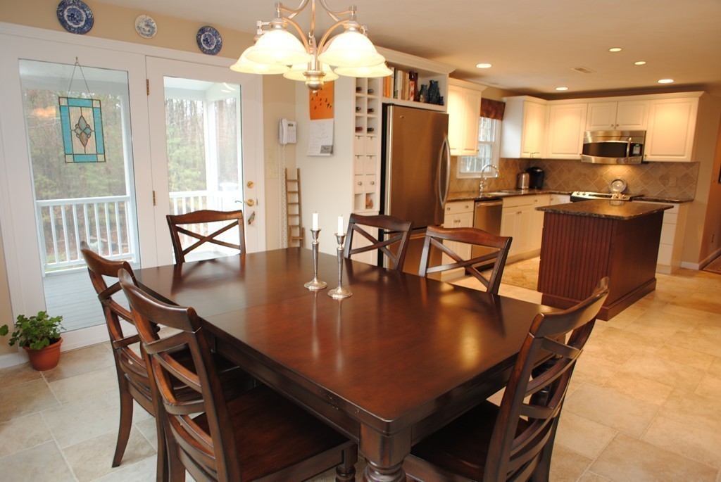 61 Blanchard Road Boxborough, MA 01719 - Photo 4 of 27 a view of a dining room with furniture and a chandelier