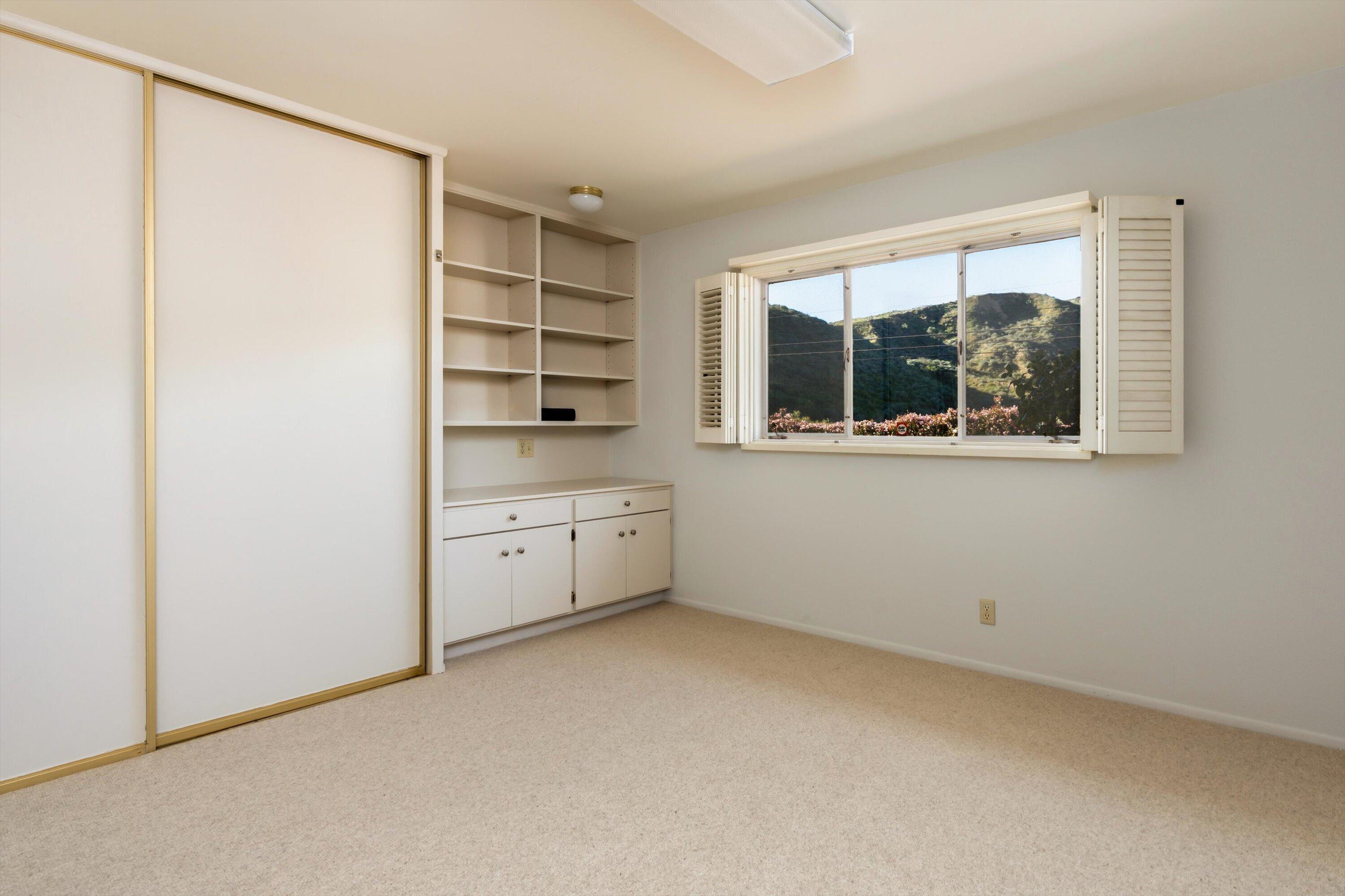 3940 Foothill Road Ventura, CA 93003 - Photo 22 of 49 an empty room with a window and a kitchen