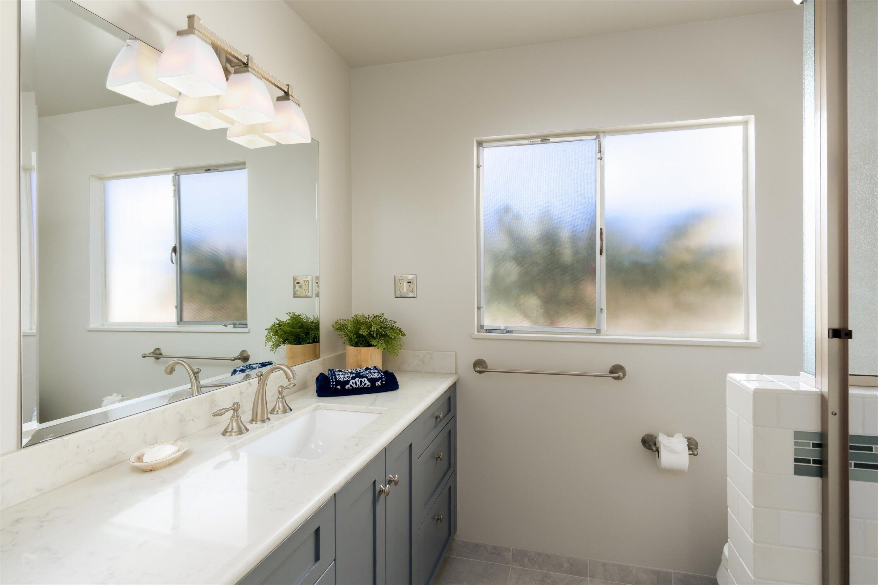 3940 Foothill Road Ventura, CA 93003 - Photo 23 of 49 a bathroom with a sink a mirror and a shower