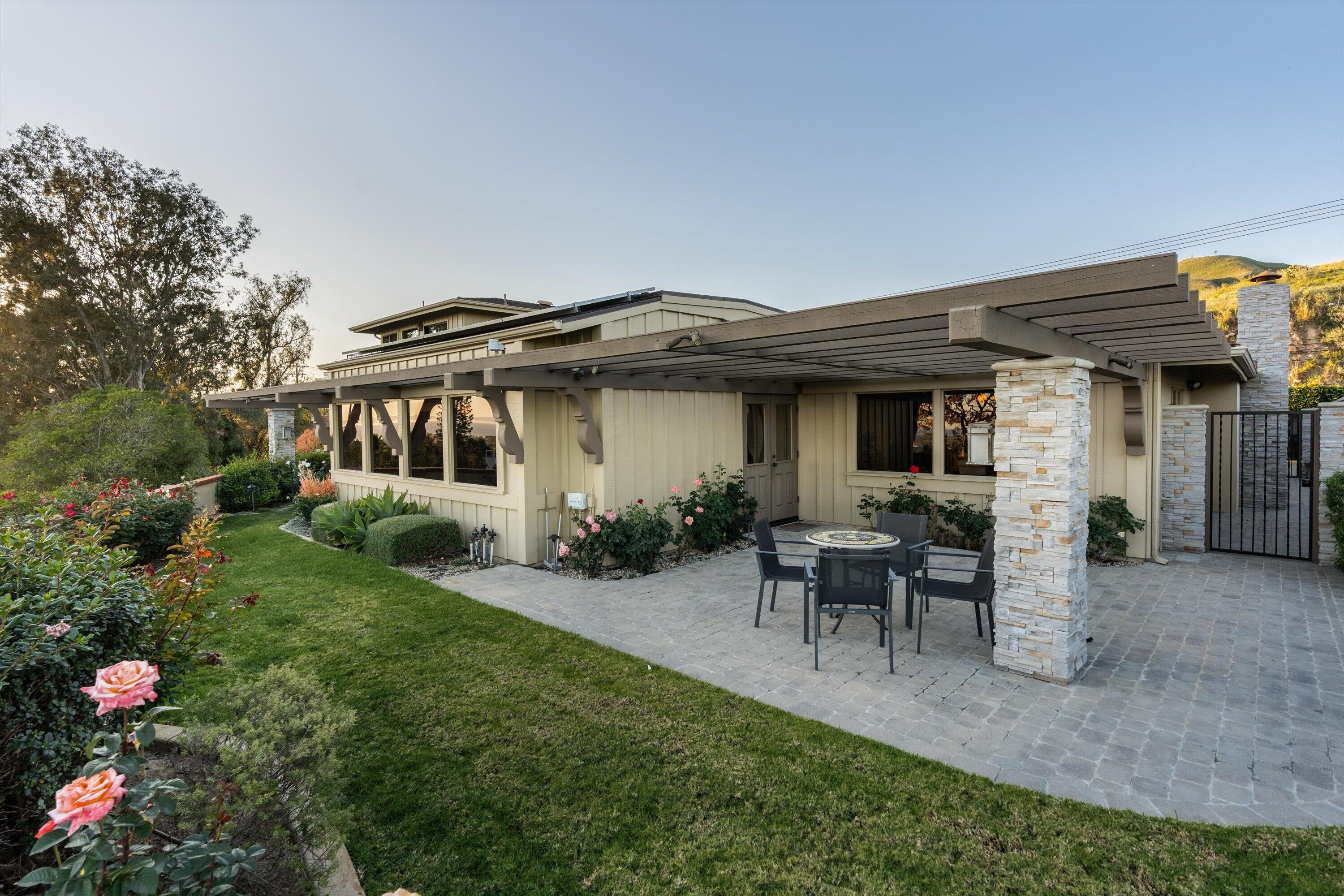 3940 Foothill Road Ventura, CA 93003 - Photo 33 of 49 a view of a house with backyard sitting area and garden