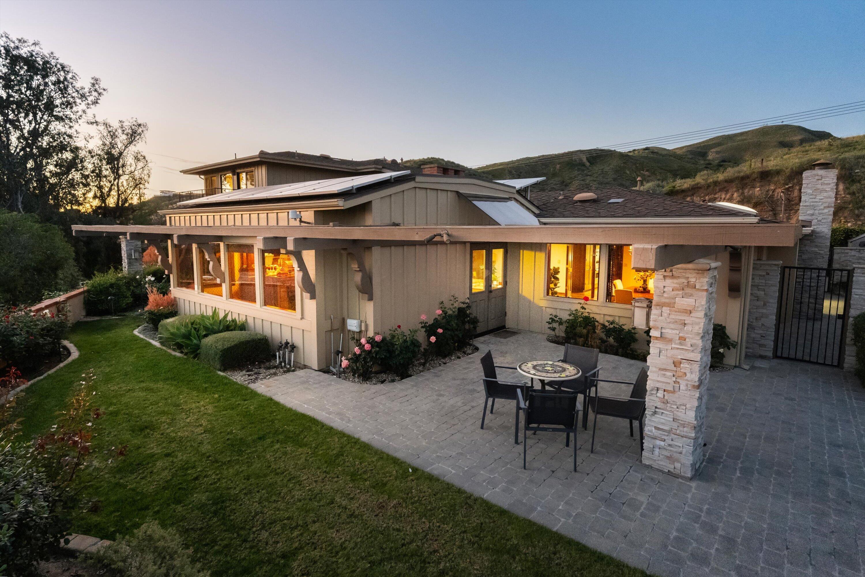 3940 Foothill Road Ventura, CA 93003 - Photo 46 of 49 a view of a house with backyard sitting area and garden