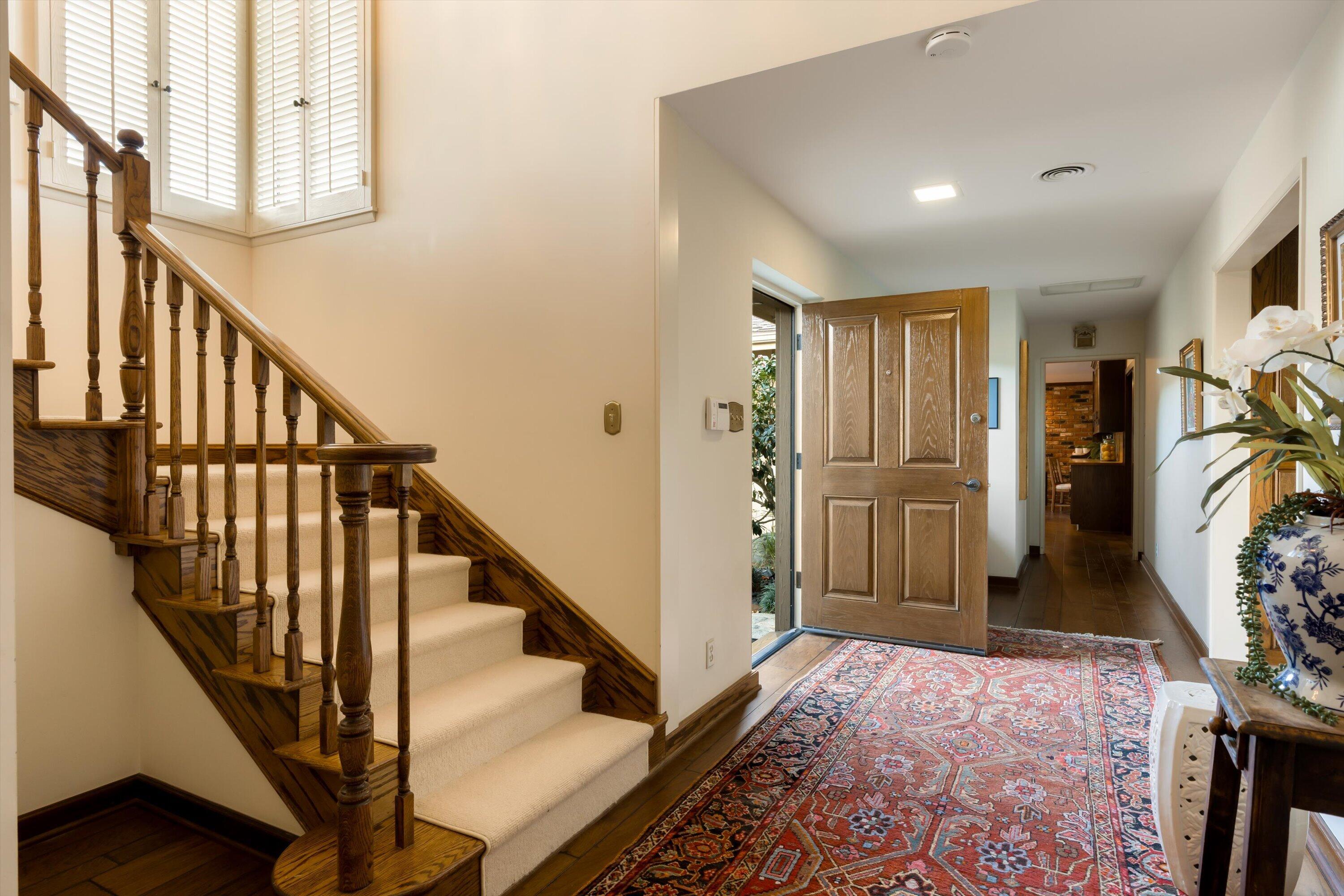 3940 Foothill Road Ventura, CA 93003 - Photo 6 of 49 a view of a hallway with wooden floor and stairs