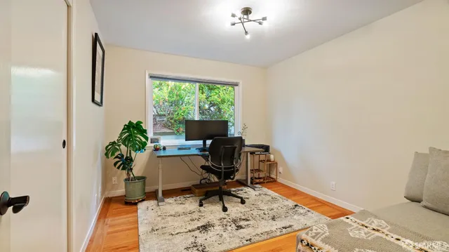 a workspace with furniture and a window