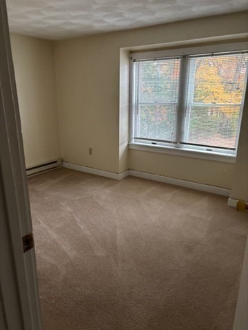 17A Maywood Lane, Unit C Woburn, MA 01801 - Photo 11 of 11 a view of an empty room with a window