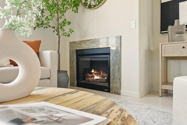 a bedroom with a bed and a fireplace