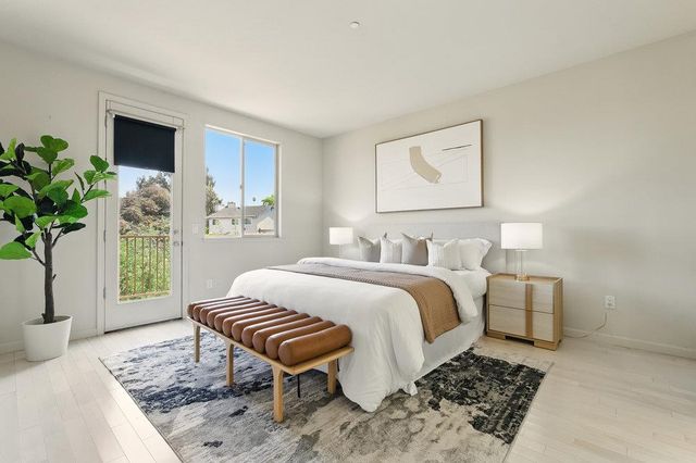 a bedroom with a bed and a couch