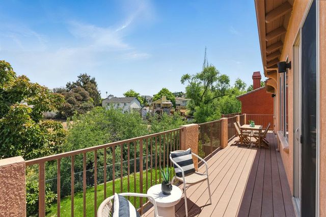 a view of a balcony with chairs