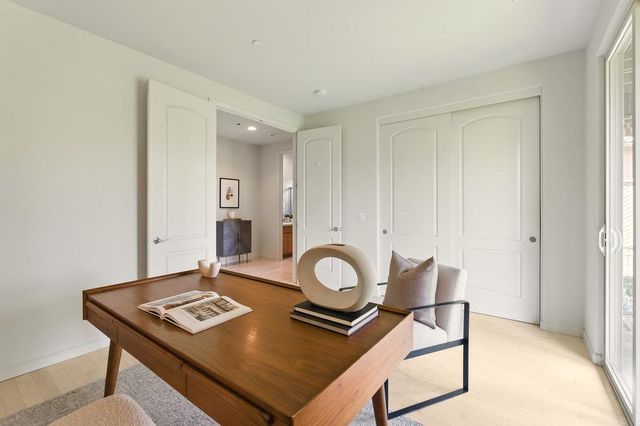 a view of a workspace with furniture