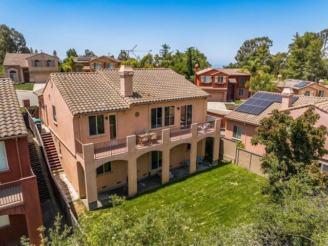a aerial view of a house with a yard