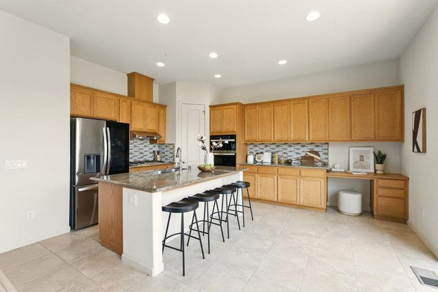 a kitchen with counter top space cabinets and stainless steel appliances