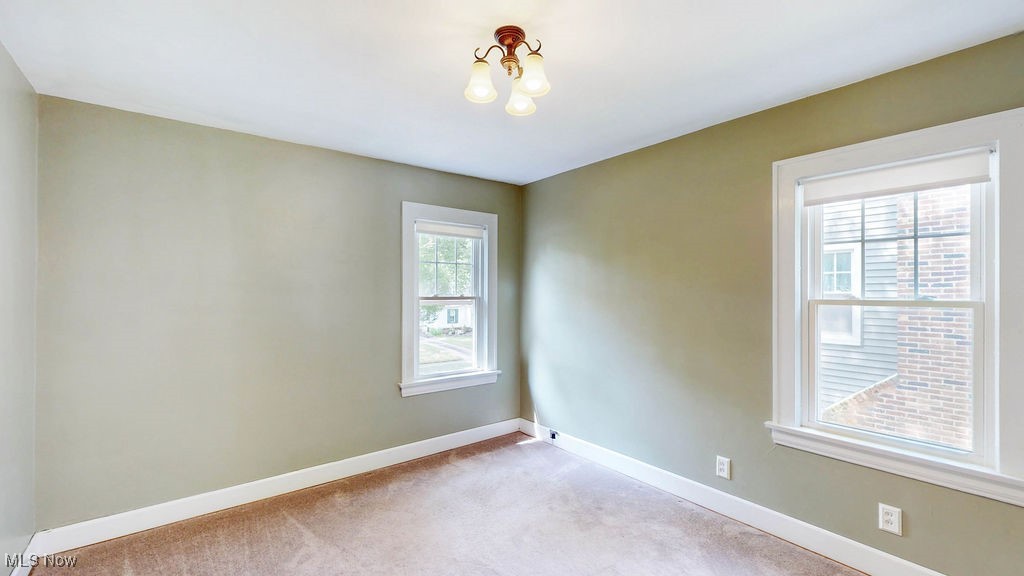 4513 East Berwald Road Cleveland, OH 44121 - Photo 23 of 36 Third bedroom with carpet and corner windows.