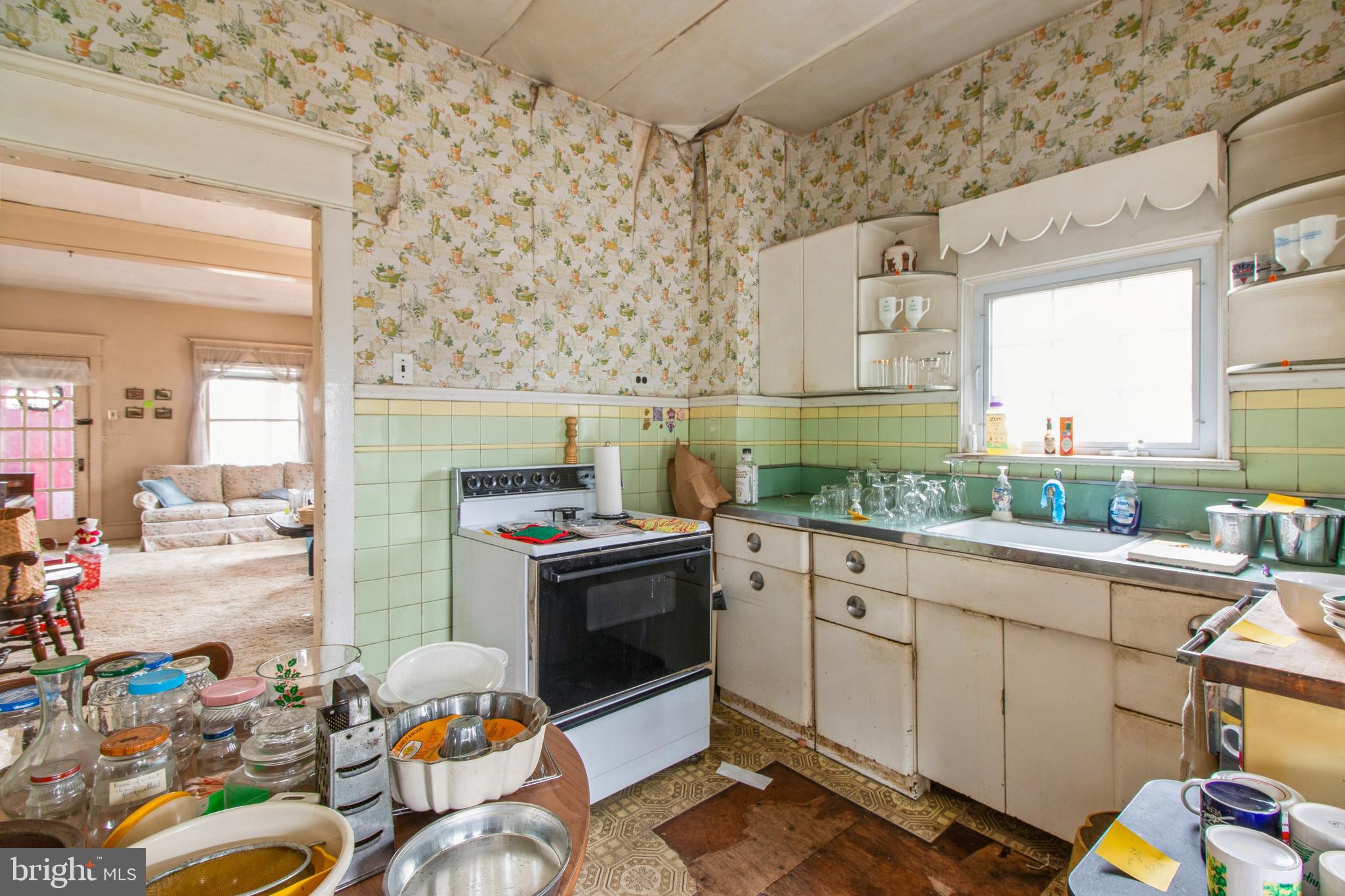 606 Highland Avenue Palmyra, NJ 08065 - Photo 11 of 25 a kitchen with stainless steel appliances kitchen island granite countertop a sink and cabinets