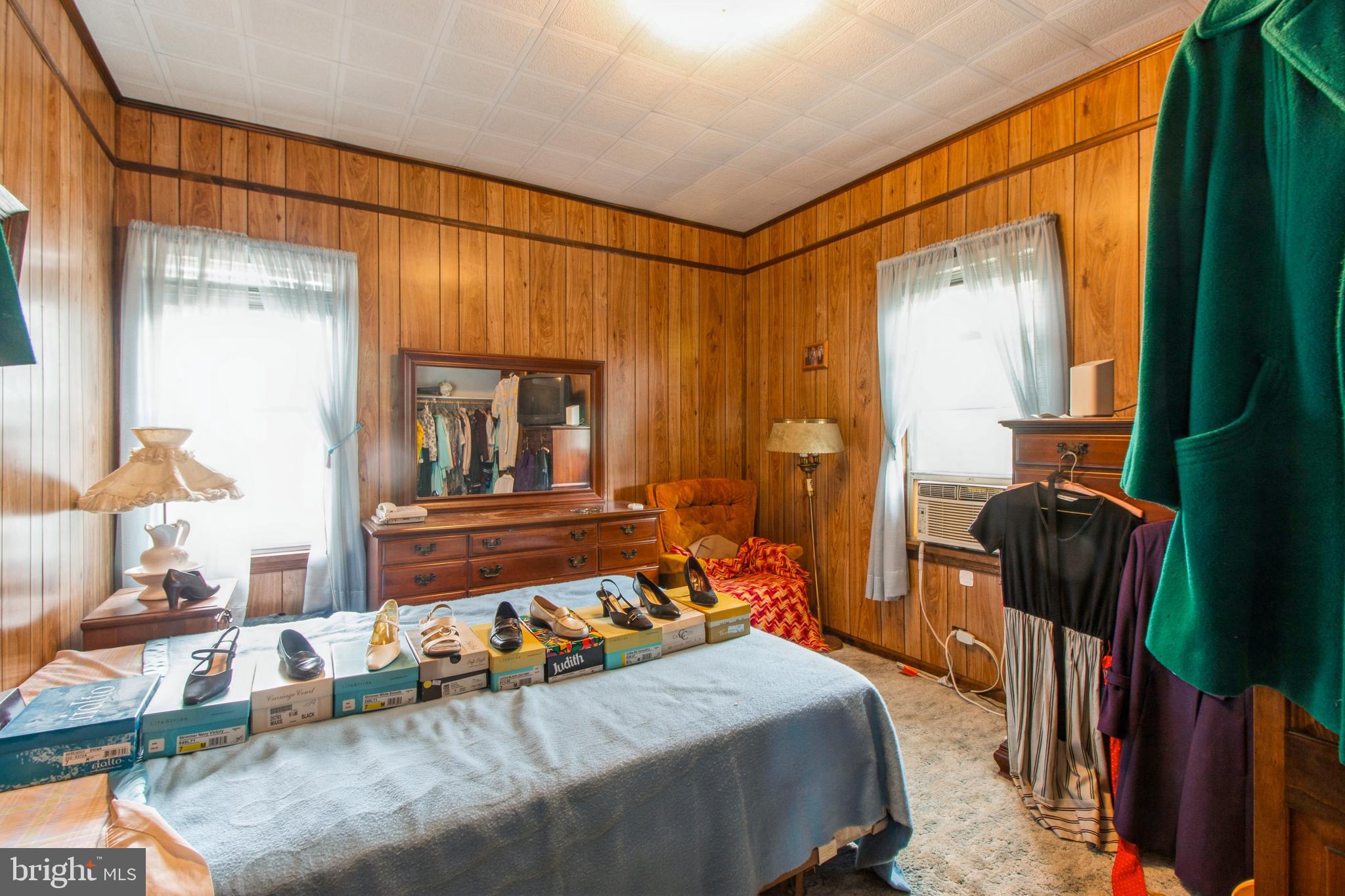 606 Highland Avenue Palmyra, NJ 08065 - Photo 13 of 25 a bedroom with a bed and large windows