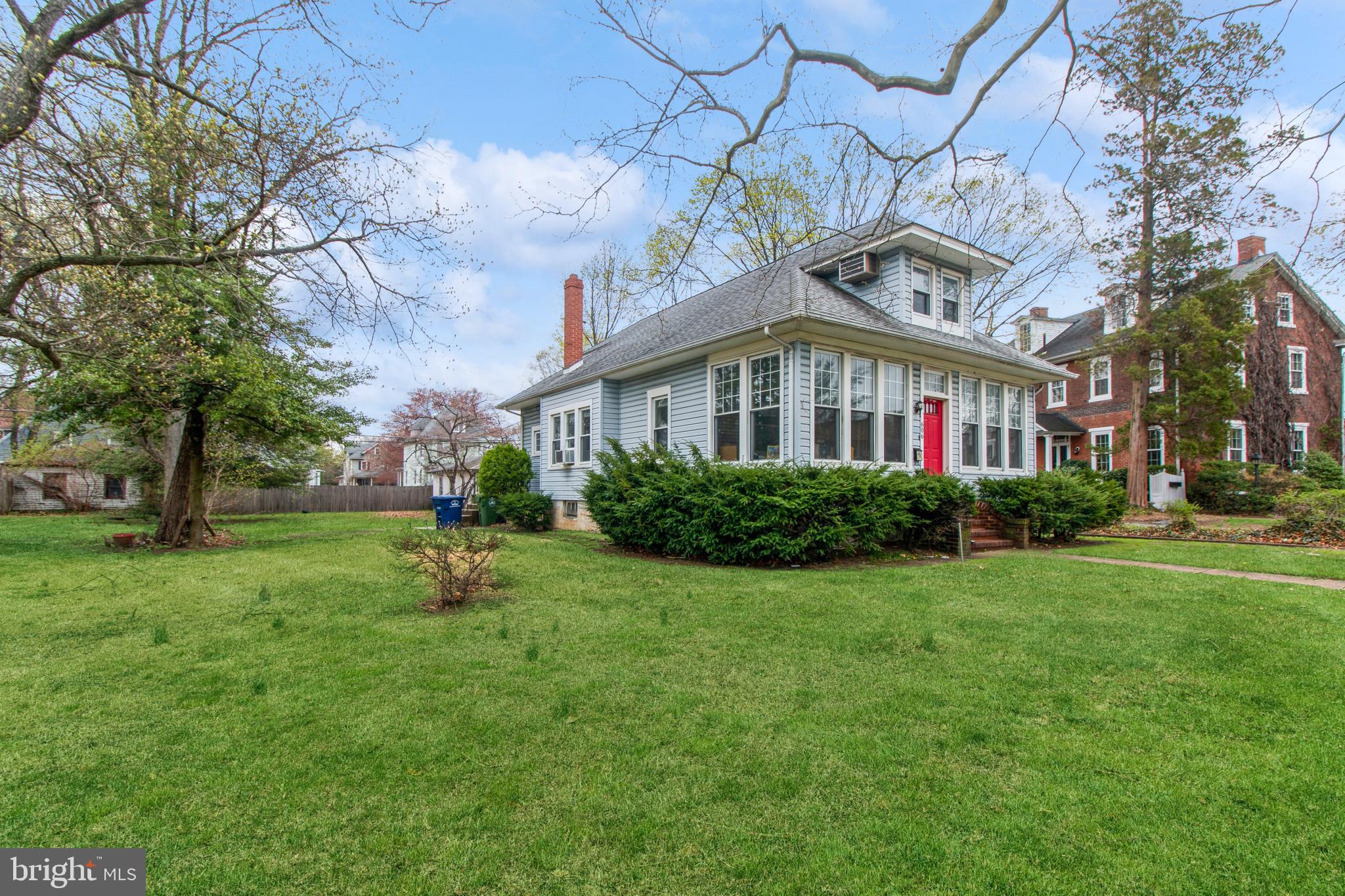 606 Highland Avenue Palmyra, NJ 08065 - Photo 2 of 25 a front view of a house with garden
