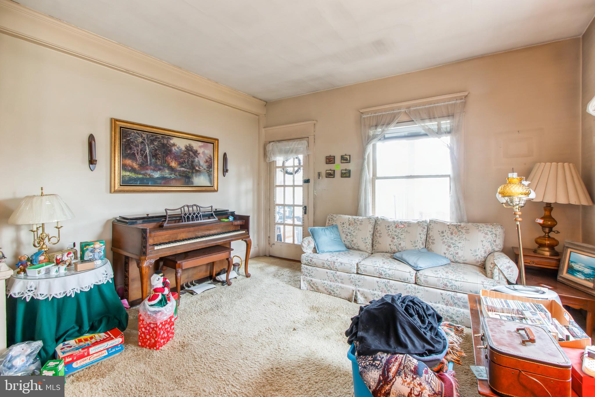 606 Highland Avenue Palmyra, NJ 08065 - Photo 8 of 25 a living room with furniture and a window