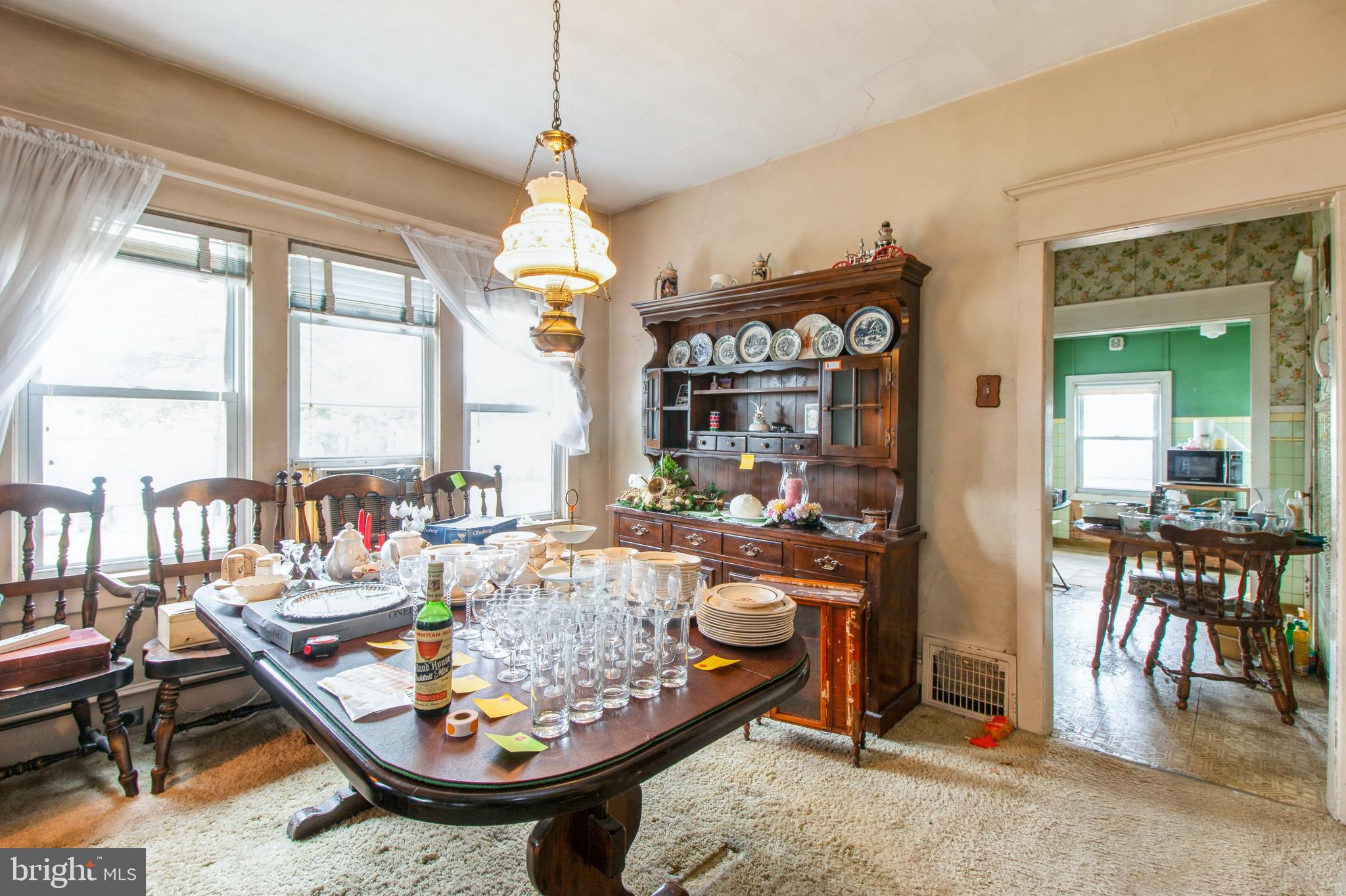 606 Highland Avenue Palmyra, NJ 08065 - Photo 9 of 25 a very nice looking dining room with a large dining table and a large window with wooden floor