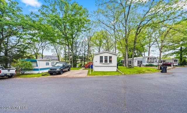 a view of an house with backyard space and garden