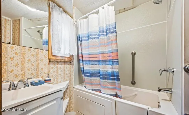 a bathroom with a sink and a bathtub