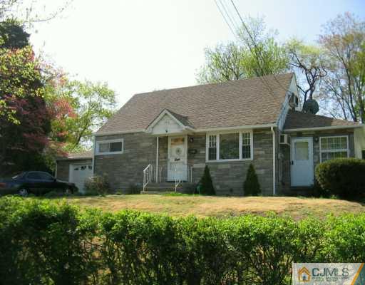 49 Wilcox Road New Brunswick, NJ 08901 - Photo 1 of 8 a front view of a house with a garden