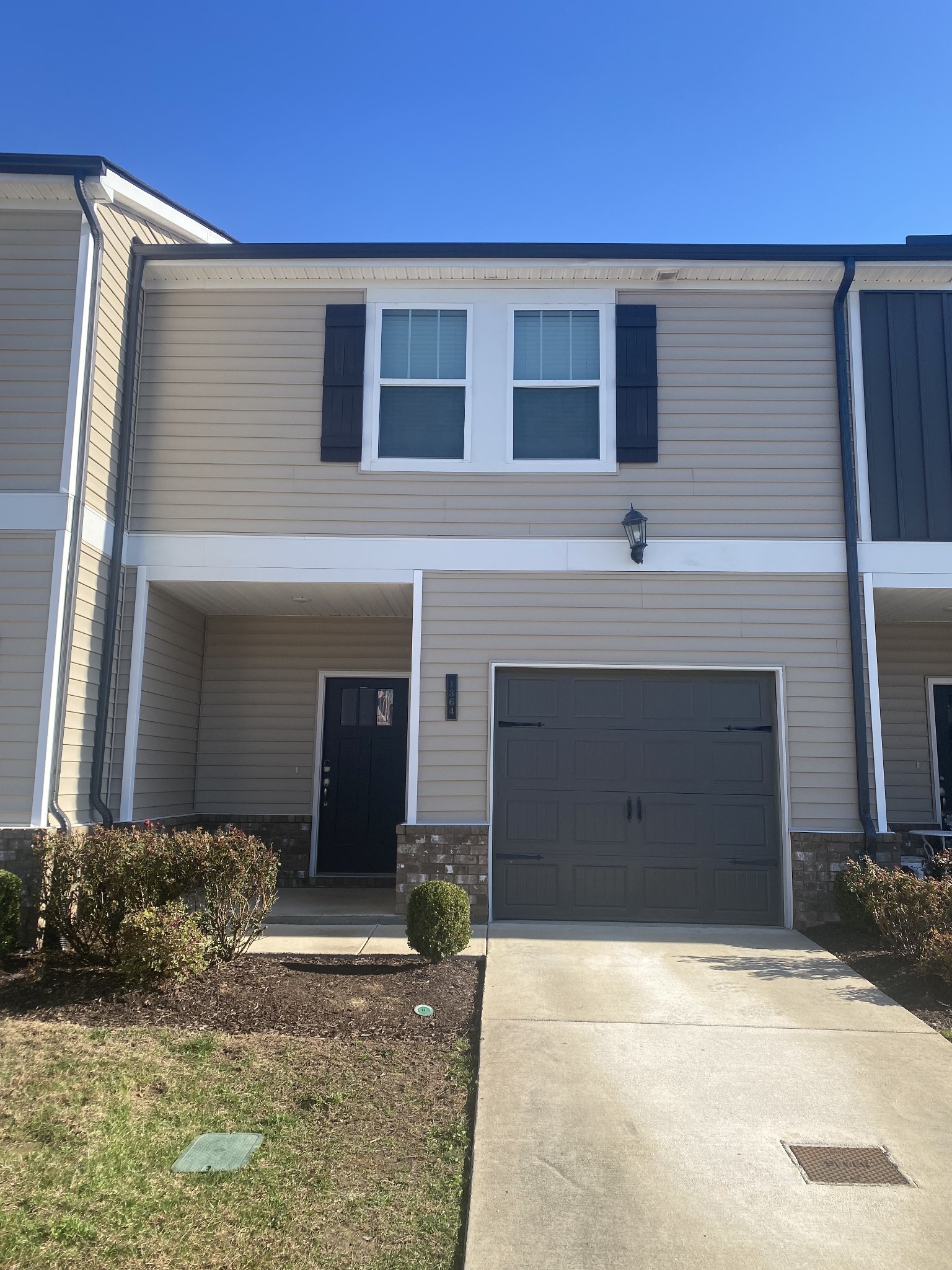 1364 Vilda Way Lebanon, TN 37087 - Photo 1 of 18 a front view of a house with a yard and garage