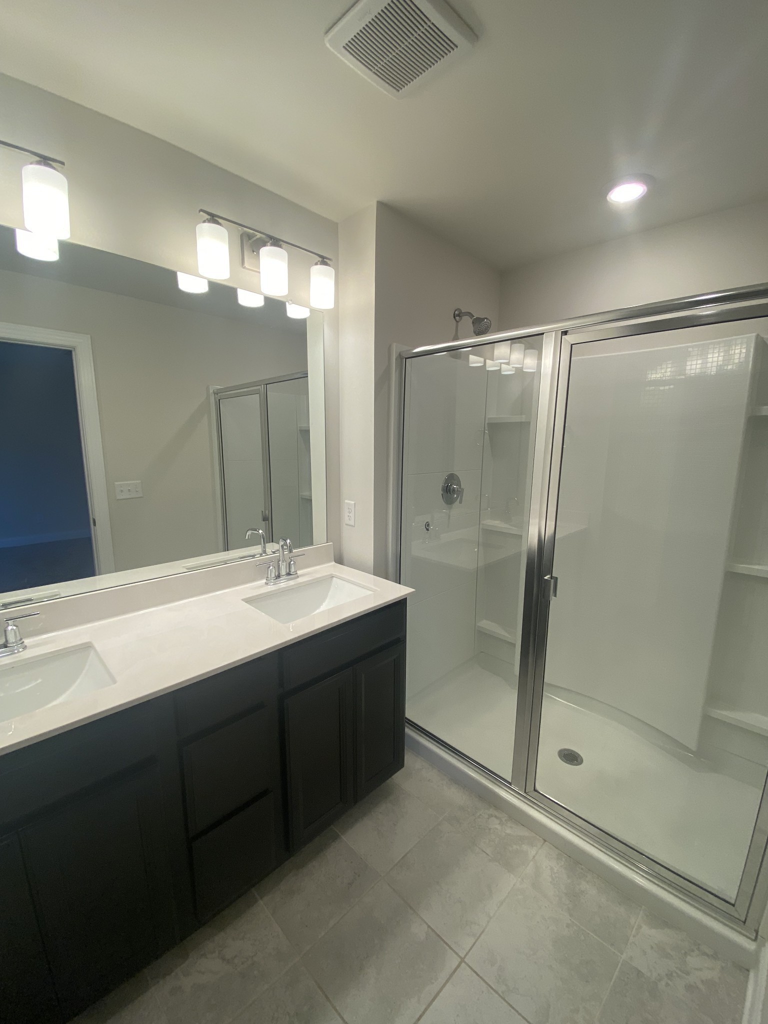 1364 Vilda Way Lebanon, TN 37087 - Photo 12 of 18 a bathroom with a shower sink and mirror