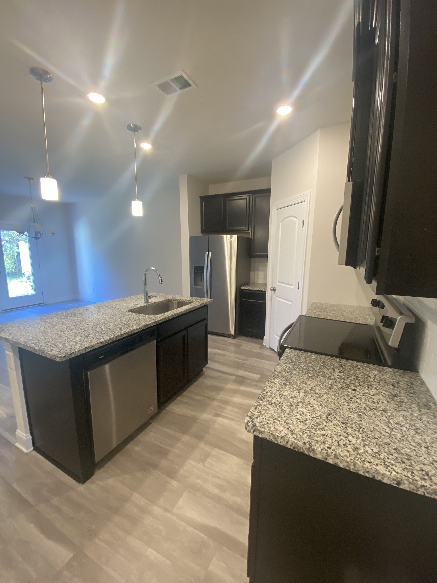 1364 Vilda Way Lebanon, TN 37087 - Photo 4 of 18 a kitchen with a sink a counter top space and cabinets